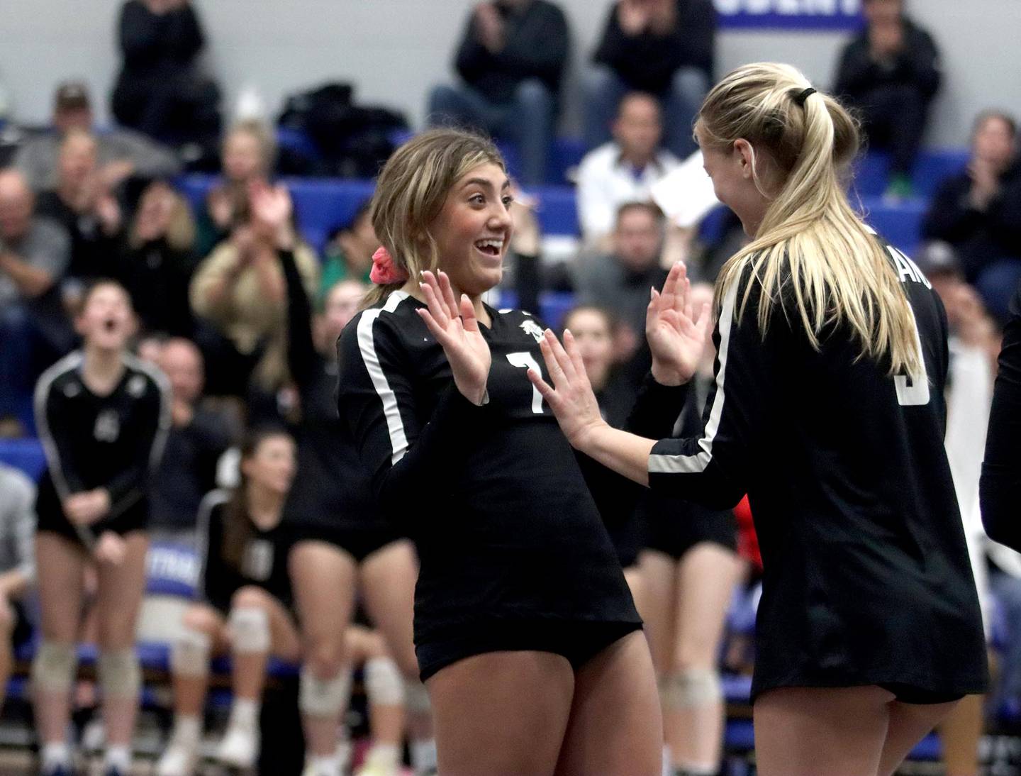 Kaneland’s Frankie Brandonisio, left, celebrates with Meredith Milz late in a two-set win over Prairie Ridge in Class 3A volleyball sectional action at Burlington Central on Monday.