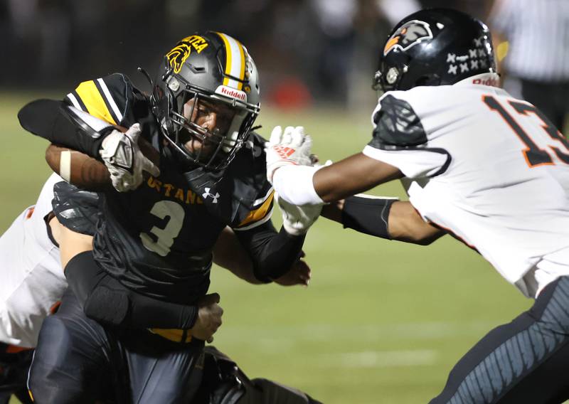 Metea Valley's Da’Marion Lewis tries to get by DeKalb’s Davon Grant during their game Friday, Sept 15, 2023, at Metea Valley High School in Aurora.