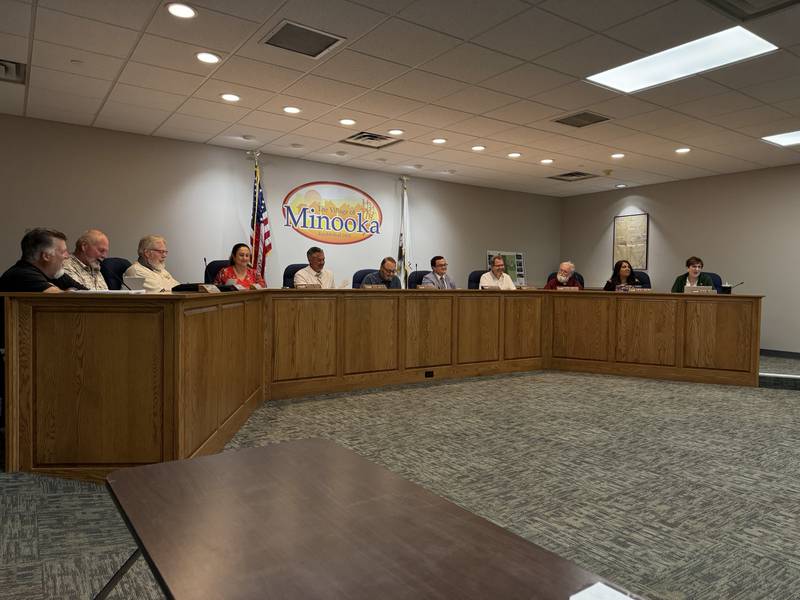 The Minooka Village Board met Tuesday night, approving the filing of a lawsuit against Canadian National and Wisconsin Central Limited to find out whether or not the village can enforce its already-existing weight limits on McLinden Road. Pictured from left to right are trustees Barry Thompson, Ray Mason, Terry Houchens, Village Clerk Orsola Evola, Village Administrator Dan Duffy, Village President Ric Offerman, Attorney Mike Santschi, and trustees Sean Kelly, Dennis Martin, Gabriela Martinez and Robin White.