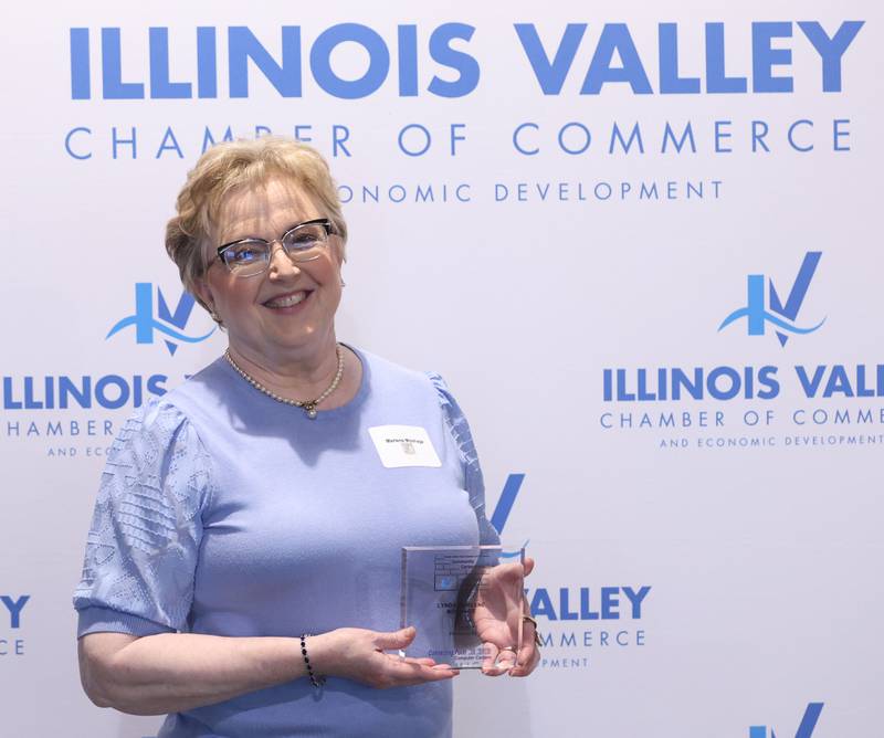 Marlene Moshage poses with her Cornerstone award during the Illinois Valley Chamber of Champions of Change Awards Night on Wednesday, May 6, 2026 at the Westclox Event Center in Peru.