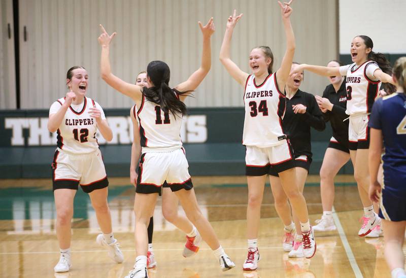 Members of the Amboy/Ohio girls basketball team react after winning the Class 1A Regional championship over Marquette on Thursday, Feb. 20, 2025 at St. Bede Academy.