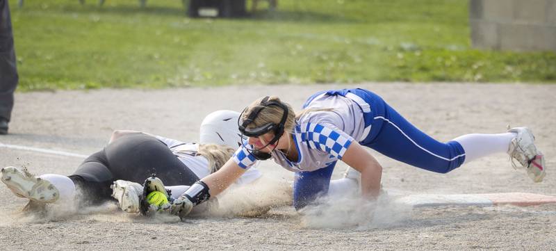 Newman’s Sam Ackman puts the tag down on Putnam County’s Tori Balma Thursday, May 18, 2023.