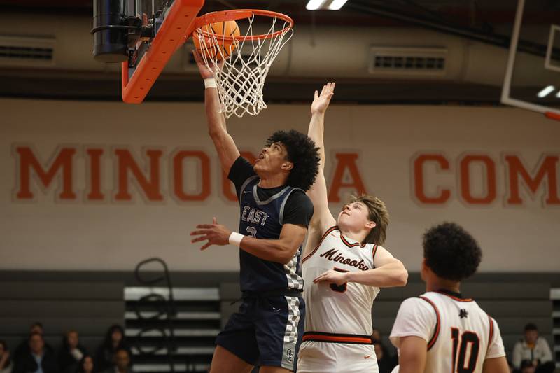 Oswego East’s Jacsen Tucker lays in a shot against Minooka on Friday, Jan. 16, 2026 in Minooka.