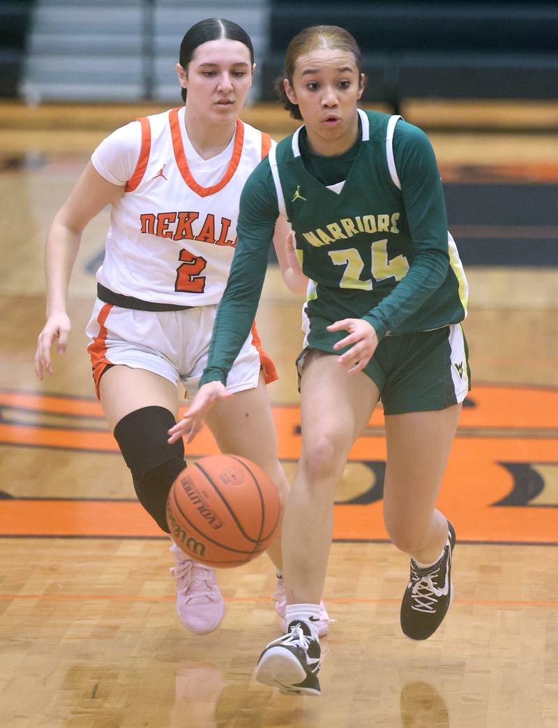 Waubonsie Valley's Khaliah Reid pushes the ball ahead of DeKalb's Ella Medina during their game Thursday, Dec. 15, 2022, at DeKalb High School.