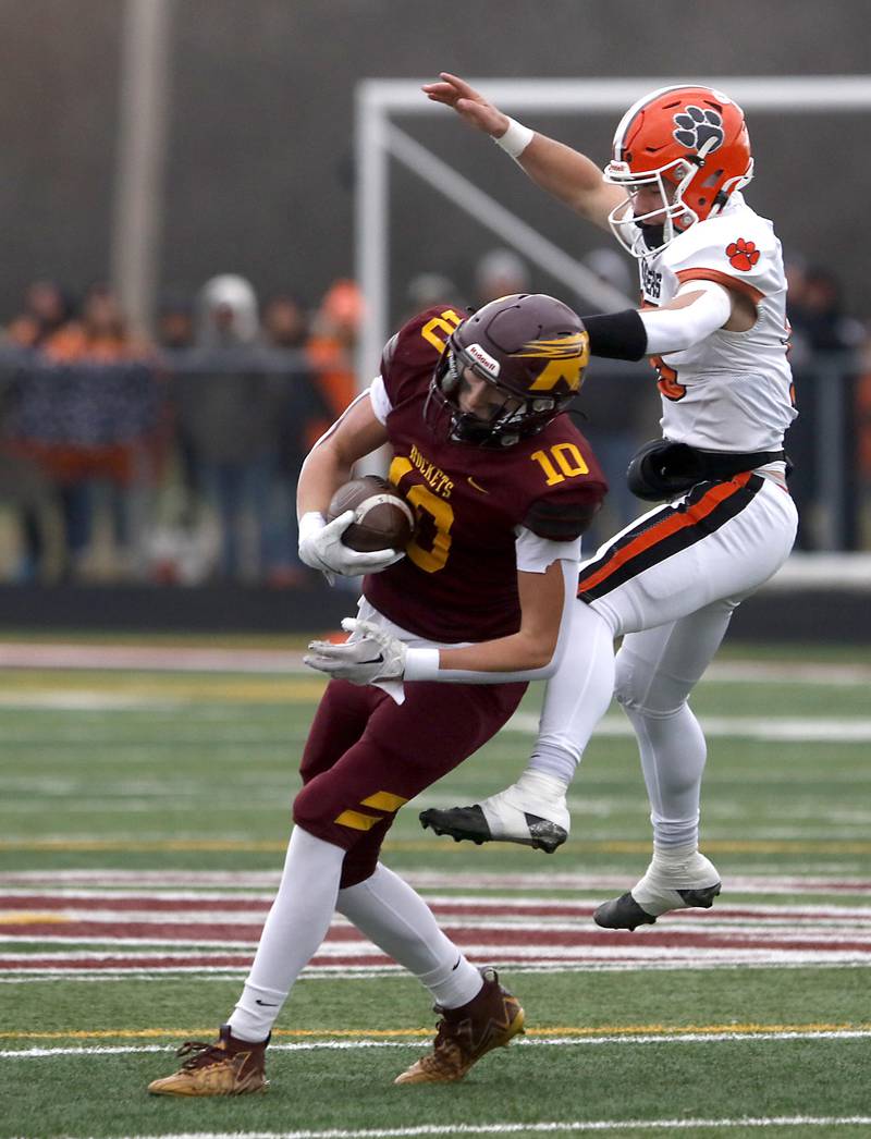 Richmond-Burton's Ray Hannemann catches a pass in front of Byron's Dawson Criddle during an IHSA Class 3A semifinal playoff football game on Saturday, November 22, 2025, at Richmond-Burton High School, in Richmond.