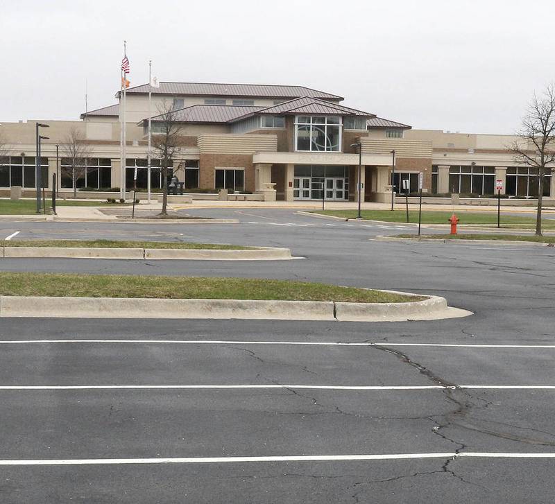 Shaw Local April 2020 file photo - The parking lot at DeKalb High School is empty Tuesday as the school remains closed due to the coronavirus crisis. Illinois Gov. J.B. Pritzker extended his stay-at-home order through the end of April during his press conference Tuesday meaning students won't be able to come back until May 1 at the earliest.