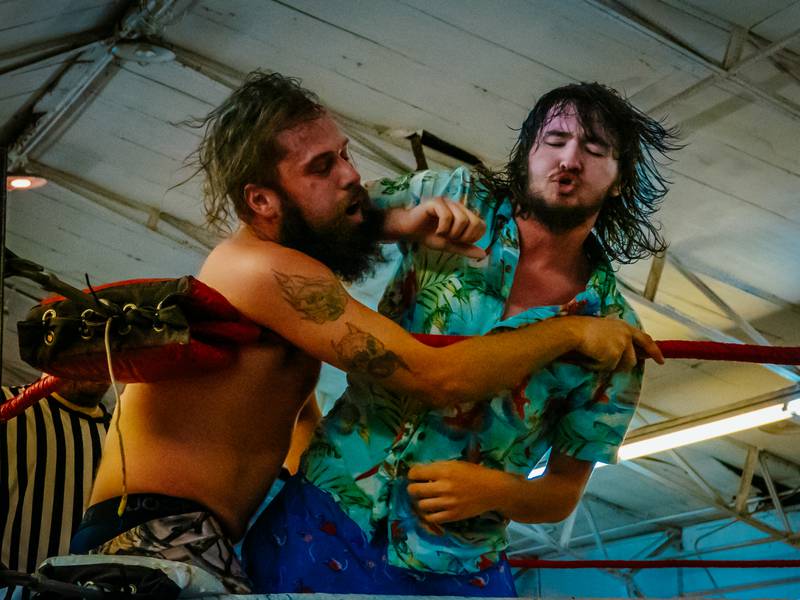 Wrestler “T-Money” punches “Bayou Bill” in a wrestling match on Saturday, August 31, 2024 at the Tri County Fair in Mendota.