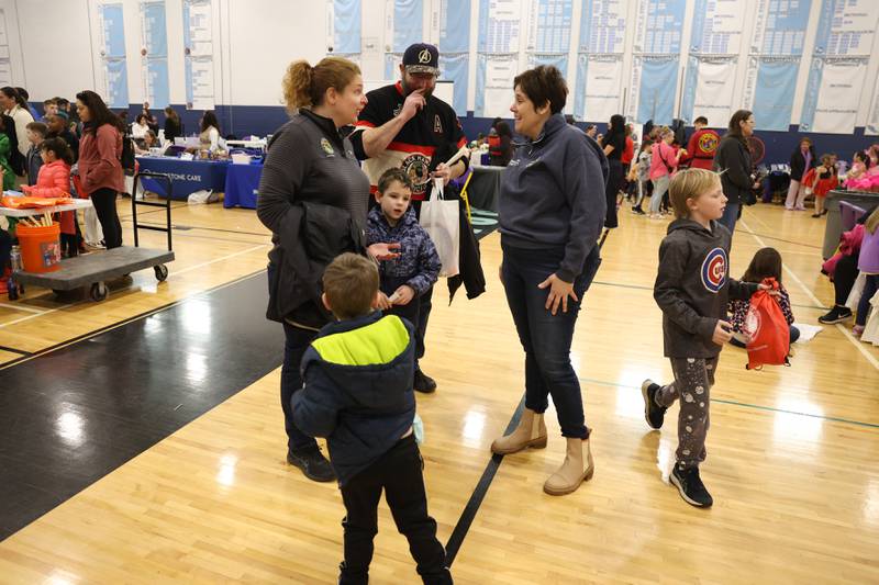 Will County Executive Jennifer Bertino-Tarrant greets a family at the Will County Executive 2024 Kids’ Fair at Troy Middle School in Plainfield on Monday, Feb. 19, 2024.