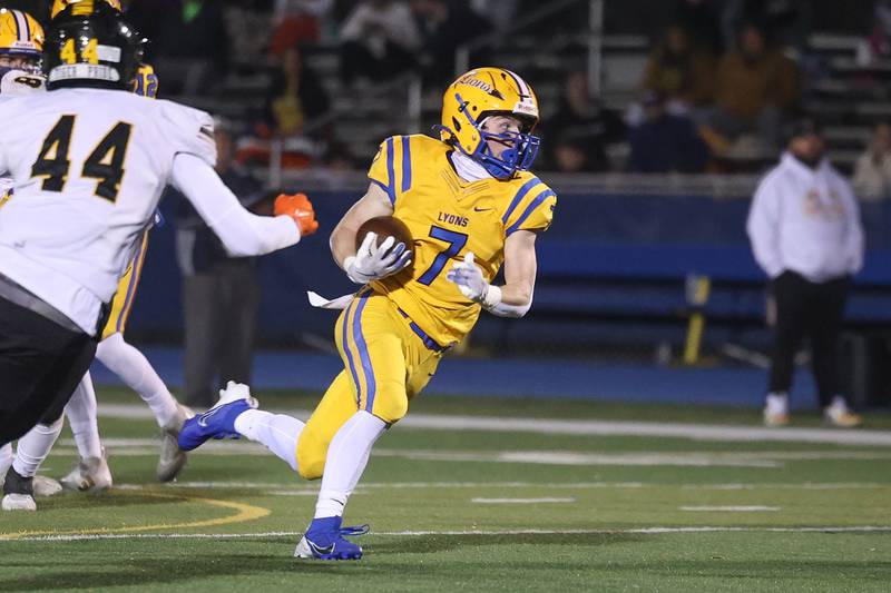 Lyons Township’s Danny Carroll finds daylight on a run against Joliet West in the first round of the playoffs on Friday, Nov. 1, 2024 in La Grange.