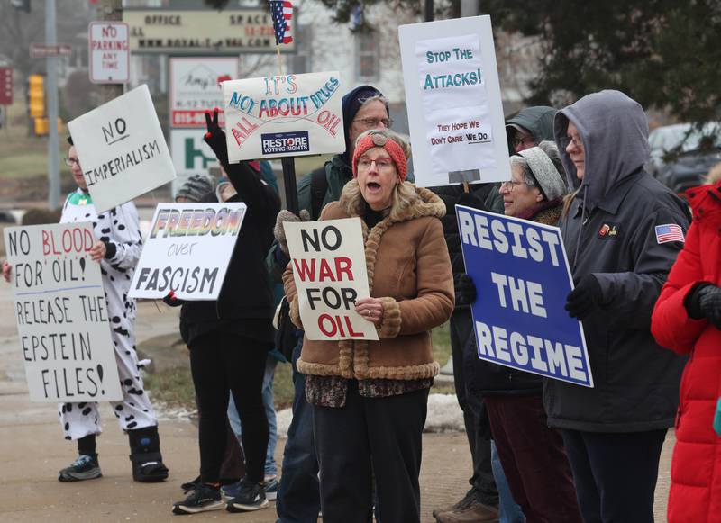 Protesters gathered Tuesday, Jan. 6, 2026, for a Venezuela Rapid Response Rally at Memorial Park on the corner of First Street and Lincoln Highway in DeKalb, to voice their opposition to President Donald Trump and the administrations recent actions in Venezuela.