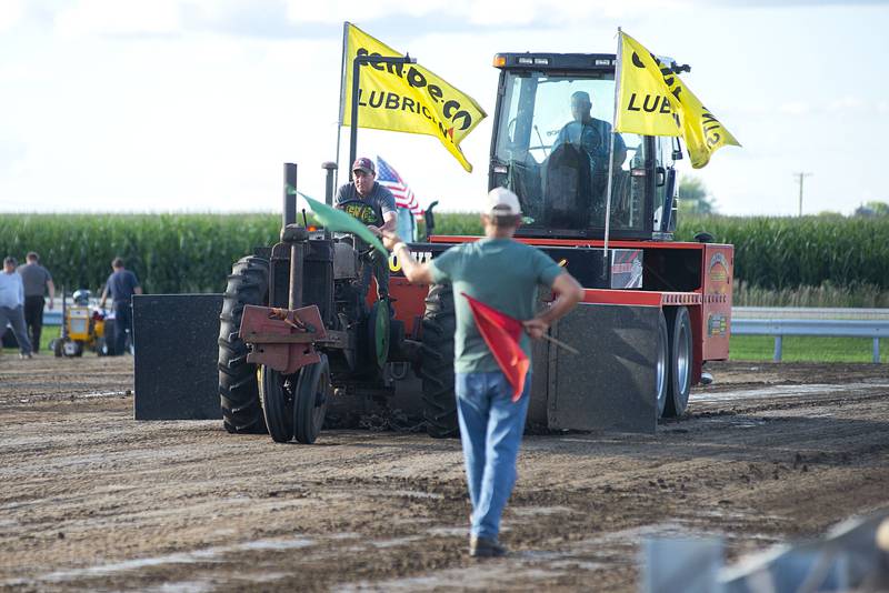 Adam Welch eyes a full pull Thursday, July 28, 2022 during the 4750 tractor class pulls at the Lee County 4H fair.