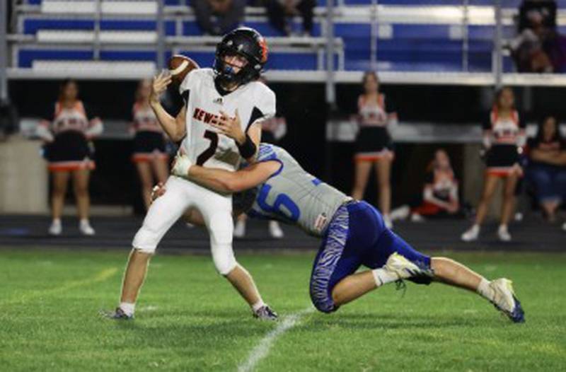 Princeton senior linebacker Common Green causes a fumble with a hit on the Kewanee quarterback Friday at Bryant Field. The Tigers won 63-12.