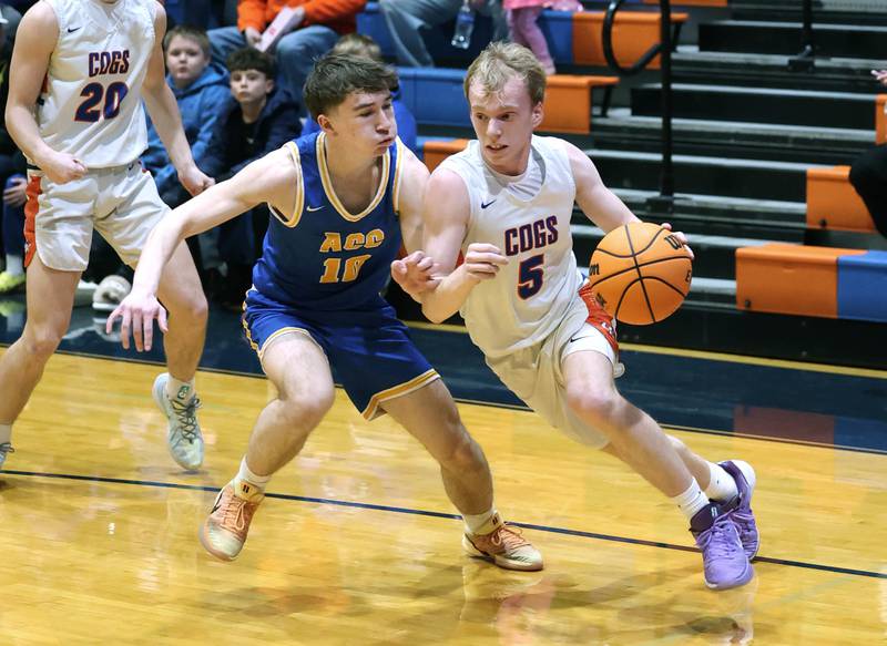 Genoa-Kingston's Blake Ides goes baseline against Aurora Central Catholic's Jack Swiatek Monday, Feb. 23, 2026, during their IHSA Class 2A regional quarterfinal at Genoa-Kingston High School.
