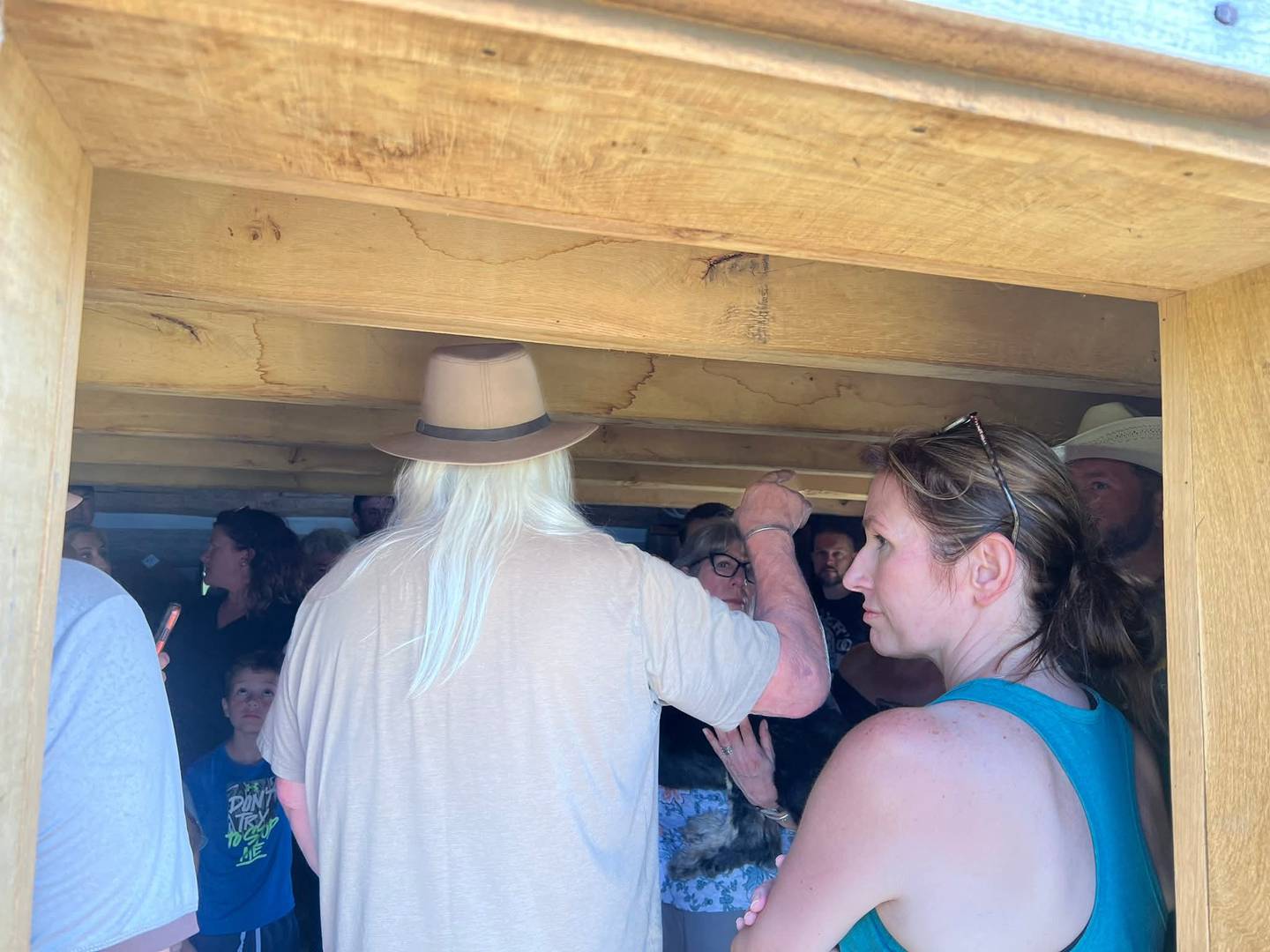 The Burgess folks are crowded in the cabin. It is pretty obvious it was standing room only. Philip Cragg Burgess is wearing the hat. Megan Burgess Chamberlin, daughter of Lisa Burgess and a sixth generation Cragg, is to his right in the doorway.