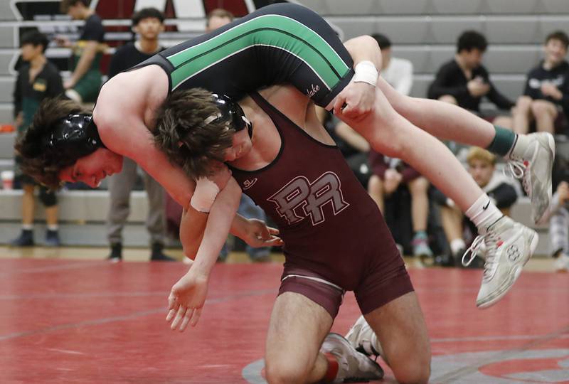 Prairie Ridge’s Mikey Meade takes down Grayslake Central’s Kyle Christophersen in a 126-pound match of the IHSA 2A Antioch Wrestling Regional on Saturday, Feb. 8, 2025, at Antioch High School.