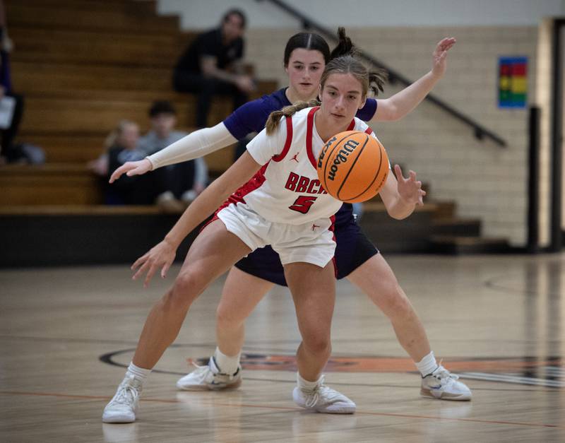 Bradley-Bourbonnais's Teegan Reddy looks to get control of the ball while guarded by Manteno's Lila Prindeville, background, in the Beecher Fall Classic on Tuesday, November 18, 2025.