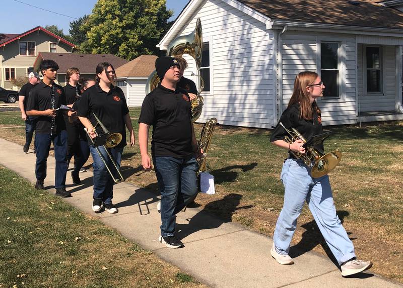 The McHenry High School band walks over to the staging area at the McHenry High School Homecoming parade Oct. 6, 2024.