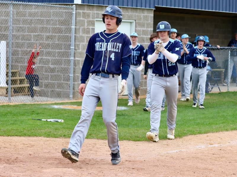 Bureau Valley's Logan Johnson scores the game-winning run in the seventh inning on a bases-loaded walk to Layton Britt to give the Storm a 5-4 win over St. Bede Monday at Manlius.
