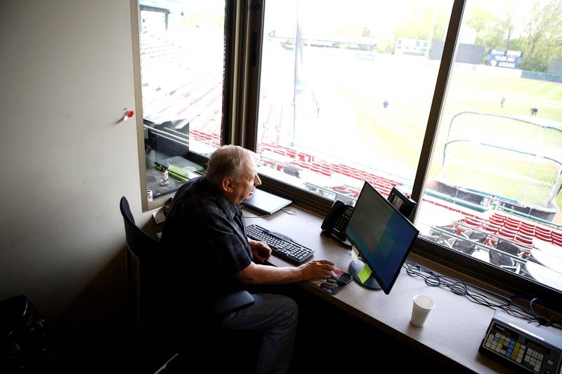 Kane County Cougars statistics guru Bill Baker looks over new scoring software at Northwestern Medicine Field in Geneva in preparation for the 2021 Kane County Cougars baseball season.