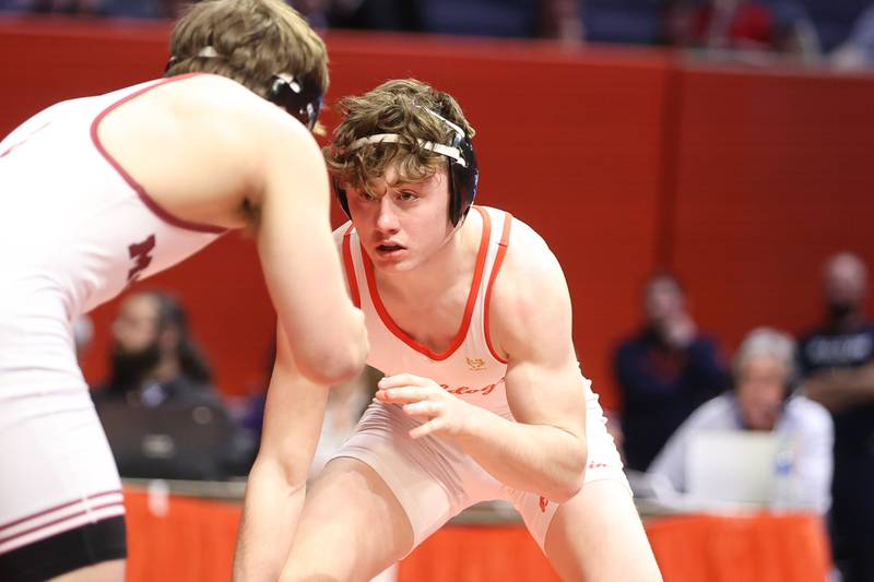 Batavia’s Kaden Fetterolf faces off against Monline’s Kole Brower in the Class 3A 138lb. championship match at State Farm Center in Champaign. Saturday, Feb. 19, 2022, in Champaign.