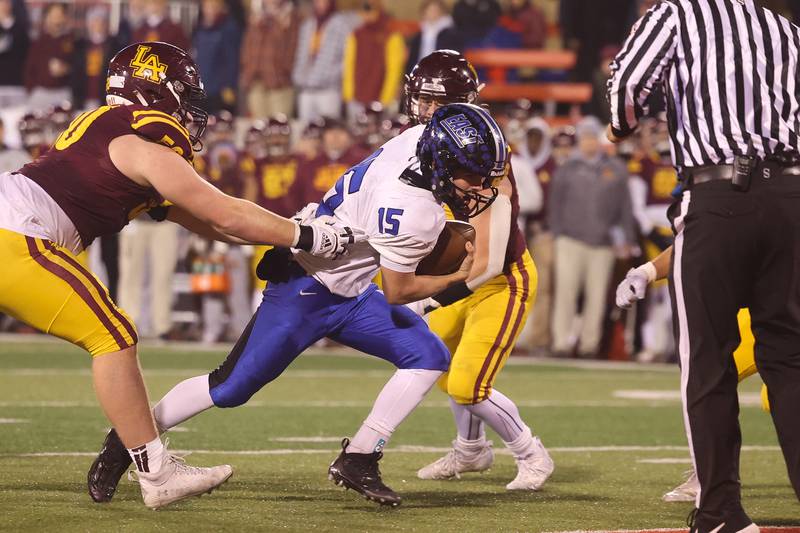 Lincoln-Way East’s Braden Tischer runs in for the two point conversion against Loyola in the Class 8A championship on Saturday, Nov. 25, 2023 at Hancock Stadium in Normal.