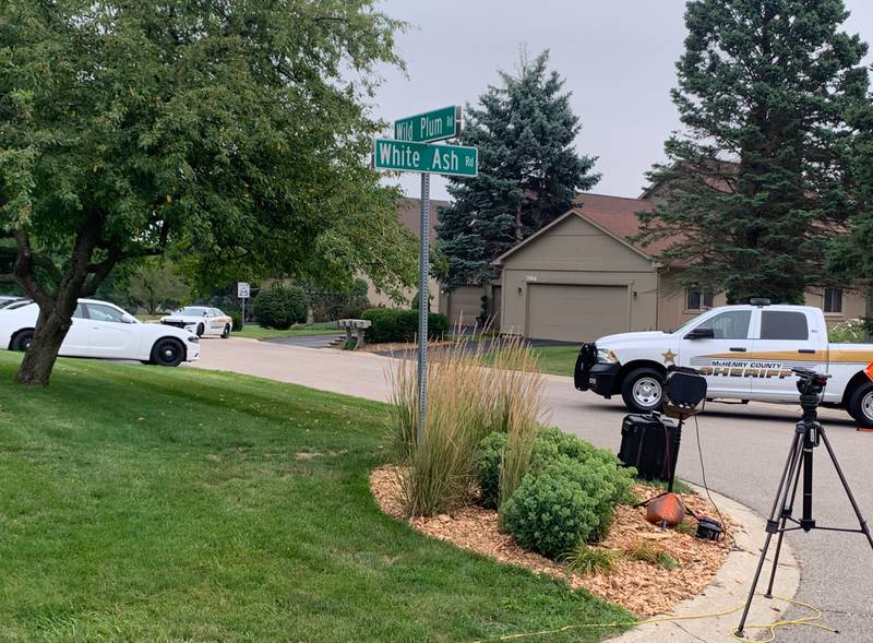 Law enforcement and media outlets gather Wednesday, Aug. 9, 2023, at Wild Plum and White Ash roads near Crystal Lake where the McHenry County Sheriff's Office said four people were shot and it was conducting a death investigation.