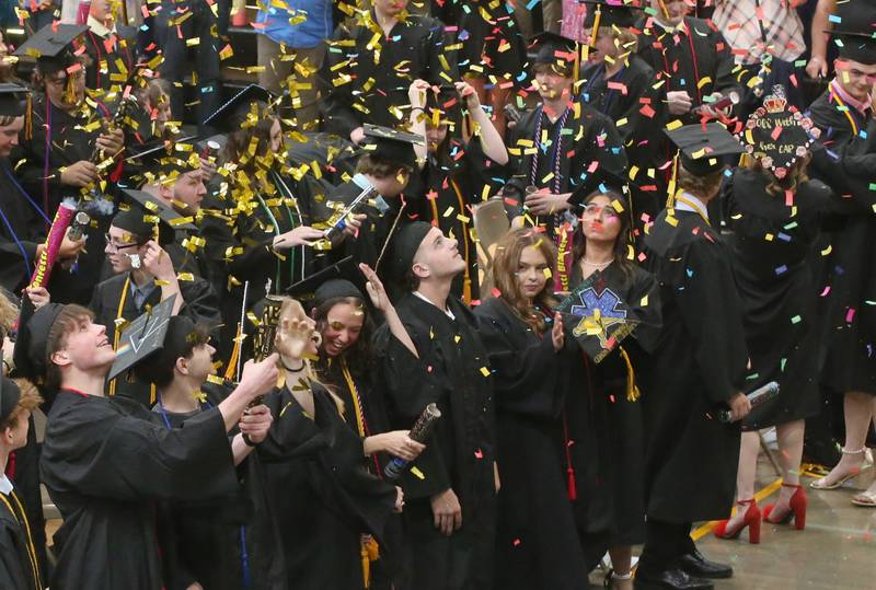 Putnam County High School Class of 2025 graduates pop confetti during the 59th annual Commencement on Sunday, May 18, 2025 in R.M. Germano gymnasium.