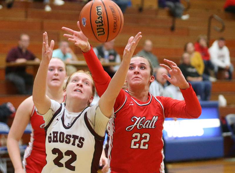 Illinois Valley Central's Brenna Phelps and Hall's Kennedy Wozniak battle for a rebound during the Princeton Holiday Girls Basketball Tournament on Tuesday, Nov. 19, 2024 at Princeton High School.