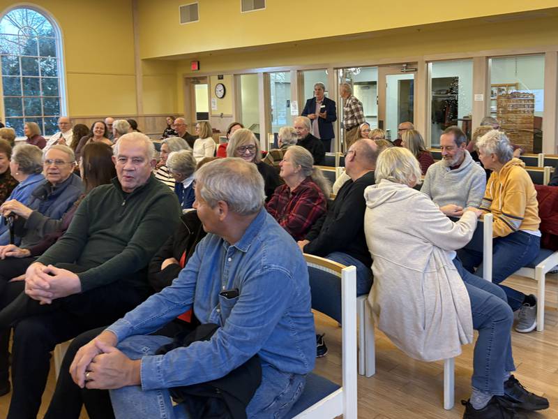Audience members talk during FaithBridge's Thanksgiving program Nov. 23, 2025 in Crystal Lake.