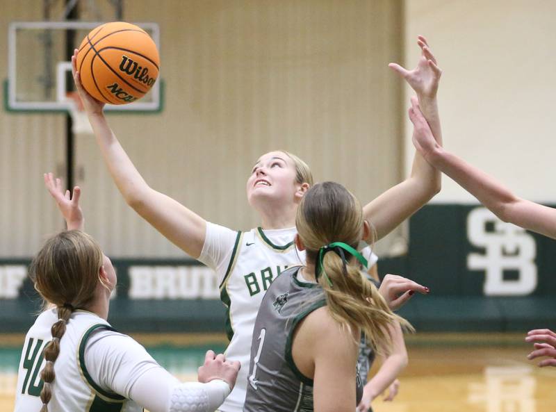 St. Bede's Tula Rue grabs a rebound over Midland's Jordyn Pyles on Thursday, Dec. 4, 2025 at St. Bede Academy.
