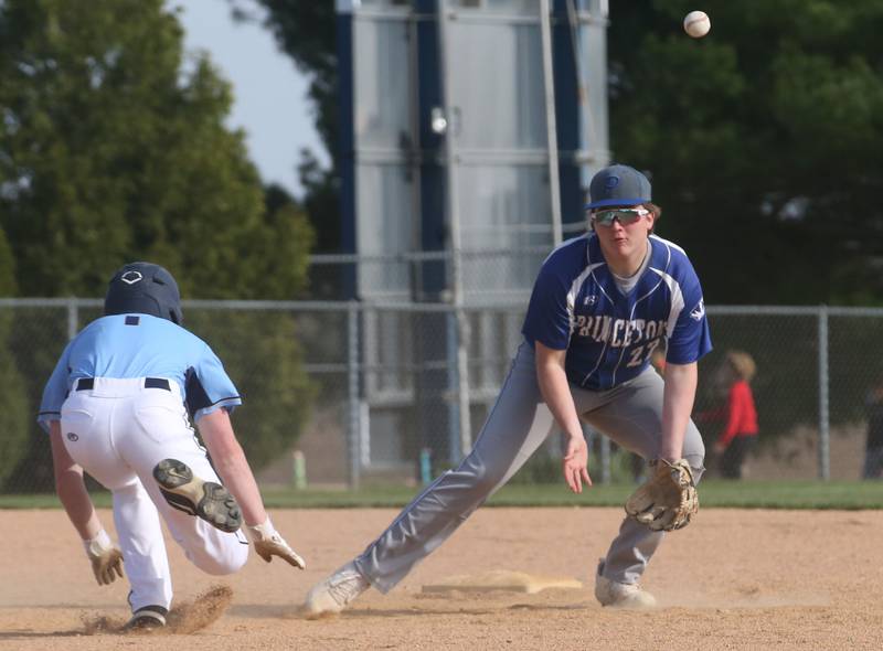 The ball gets away fro Princeton's Jordan Reinhardt as Bureau Valley's Bryce Helms slides safely into second base on Thursday, April 25, 2024 at Bureau Valley High School.