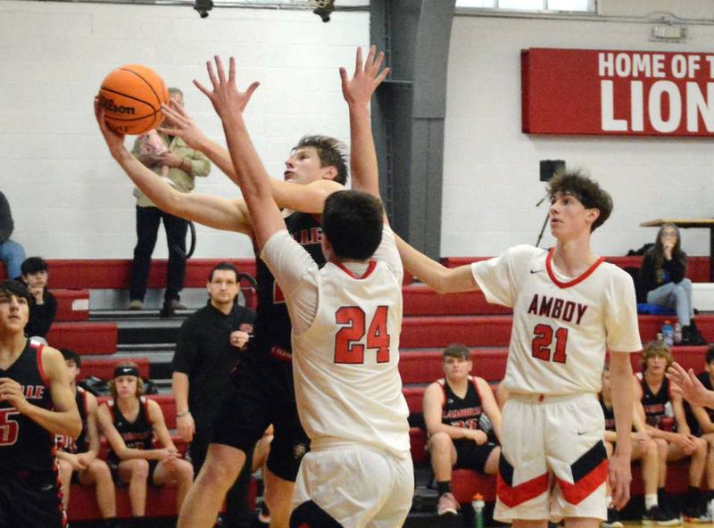 LaMoille's Brayden Klein drives against Amboy in Saturday's third-place game of the LaMoille Holiday Classic. The Clippers won 55-45.