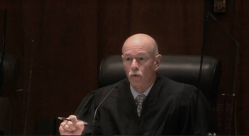 Illinois Supreme Court Justice Michael Burke asks questions Jan. 19 during oral arguments in a case challenging whether elected officials can use campaign funds to pay legal expenses stemming from public corruption charges or investigations.