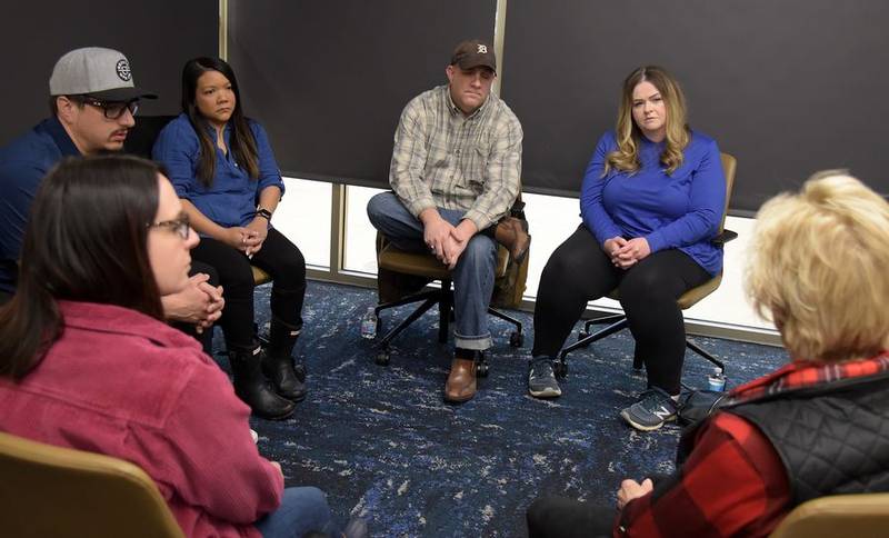 Jamie and Scott Crooks, center, of St. Charles join in a group grief counseling session with Fox Valley Hands of Hope in Geneva for people who have experienced recent miscarriage, ectopic pregnancy, stillbirth or neonatal loss.