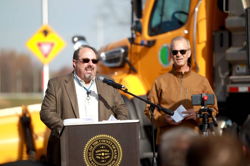 Kane County Department of Transportation Deputy Director of Transportation Thomas Rickert speaks as Director Carl Schoedel looks on before the ribbon cutting for the $12 million realignment of Bliss Road and a new roundabout connecting Bliss Road, Main Street Road and Fabyan Parkway in Blackberry Township on Thursday, Nov. 16, 2023.