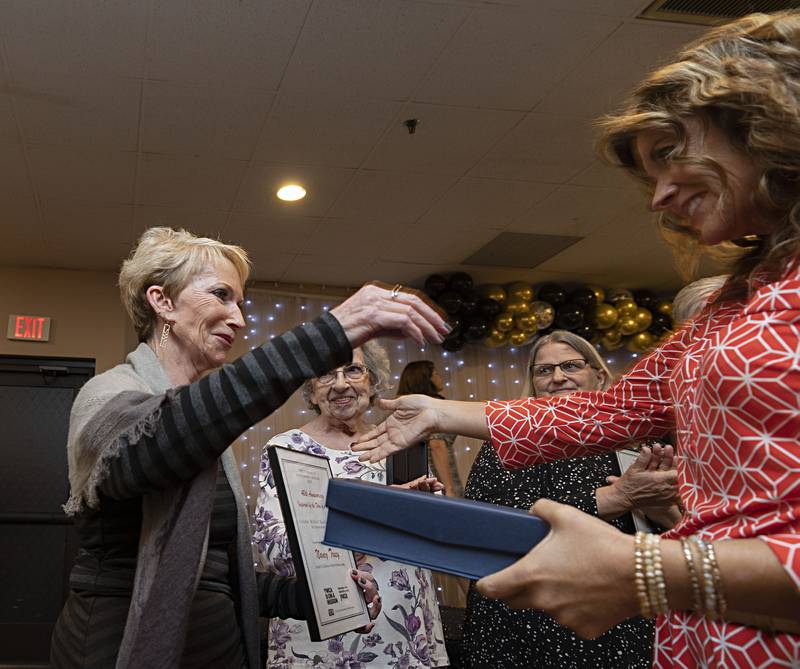 Nancy Tracy (left) embraces Laura See after being named the winner of the Louise Bittorf Sullivan Inspirational Woman award Thursday, April 13, 2023 at the YWCA Women of Achievement Luncheon.