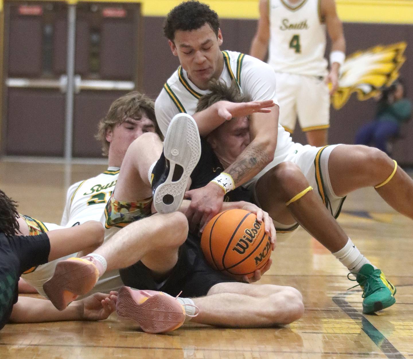 Crystal Lake South’s Cooper Buelna, right, and Ryan Morgan, left, tussle with Waubonsie Valley’s Cade Valek, center, during Hinkle Holiday Classic varsity boys basketball tournament title game action on Friday, Dec. 27, 2024 at Jacobs High School in Algonquin.