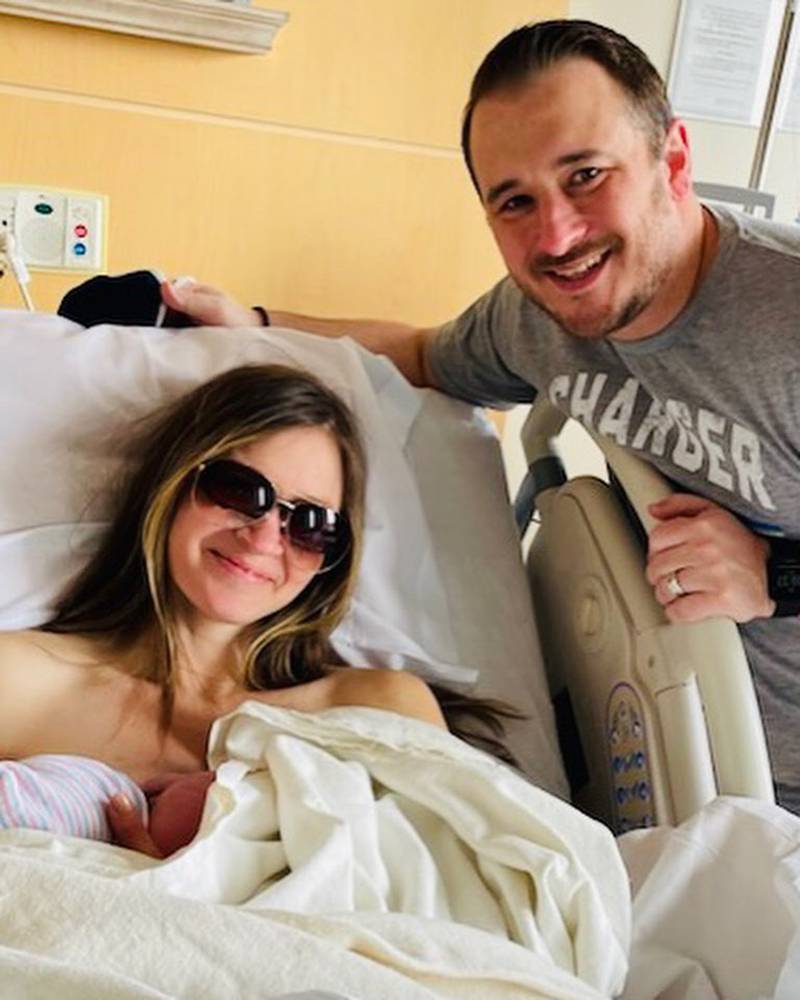 Katie and Tim Hayes, who is Dundee-Crown wrestling coach, with their newborn son Hudson, who they delivered in the car on their way to Advocate Sherman Hospital.