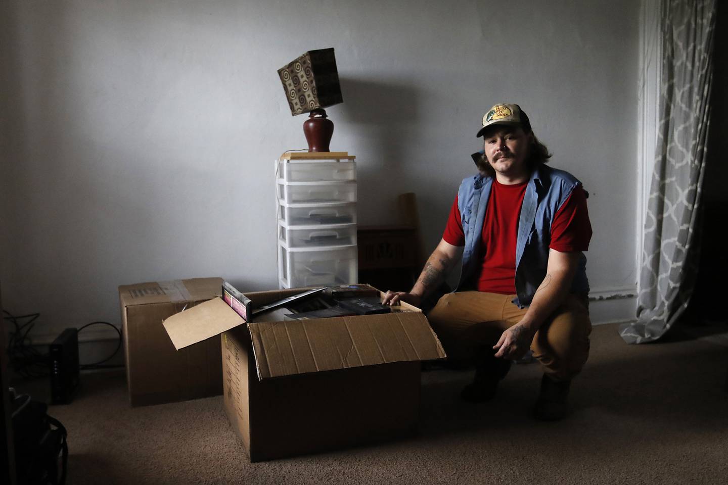 Ty Carter with some of the boxes he pre-packed at his apartment in Lake Villa on Wednesday August 3, 2022. Carter is looking for an affordable apartment to rent in McHenry County for himself and his two children .