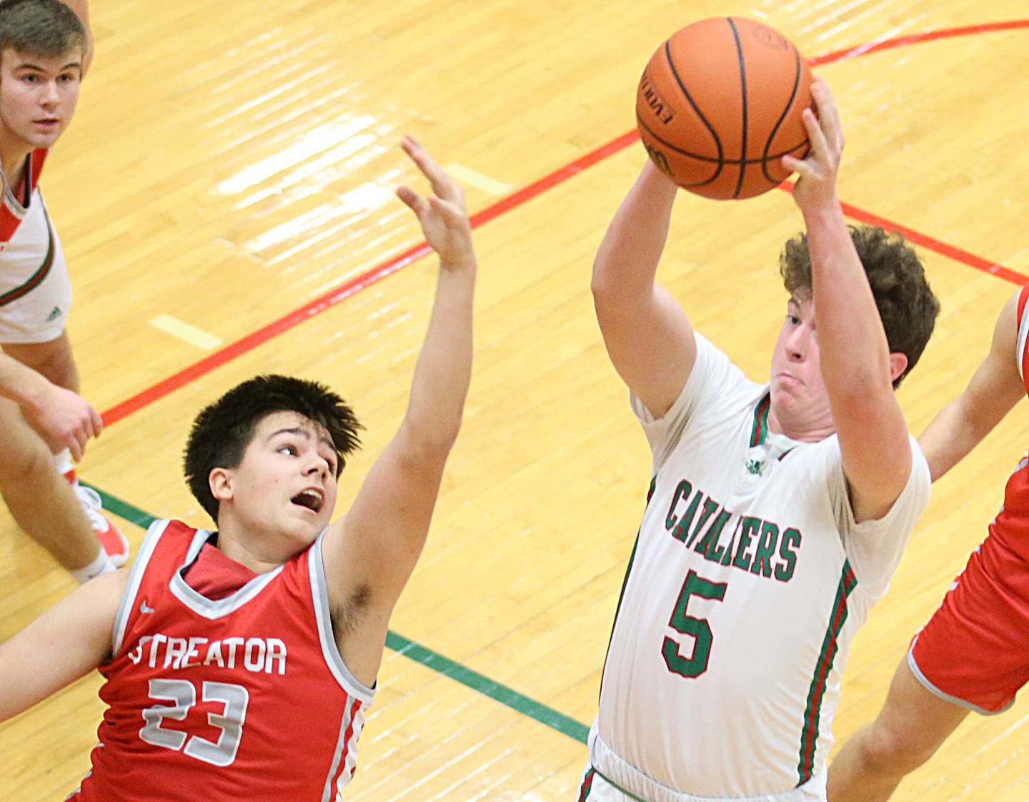 L-P's Tommy Hartman grabs a rebound over Streator's Logan Aukland on Thursday, Jan. 28, 2023 at L-P High School.