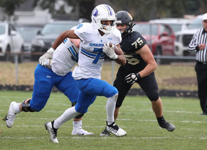 St. Francis' Jalen Carter finds a hole in the Sycamore defense Saturday, Nov. 16, 2024, during their Class 5A quarterfinal game at Sycamore High School.