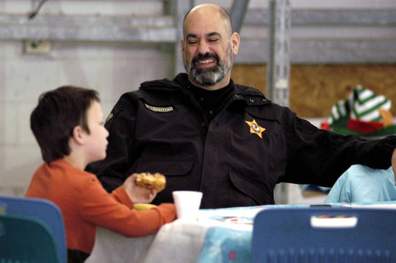 Deputy Michael Leighton talks shopping with Tommy Parker on Saturday, Dec. 13, 2025, at Sterling Walmart.