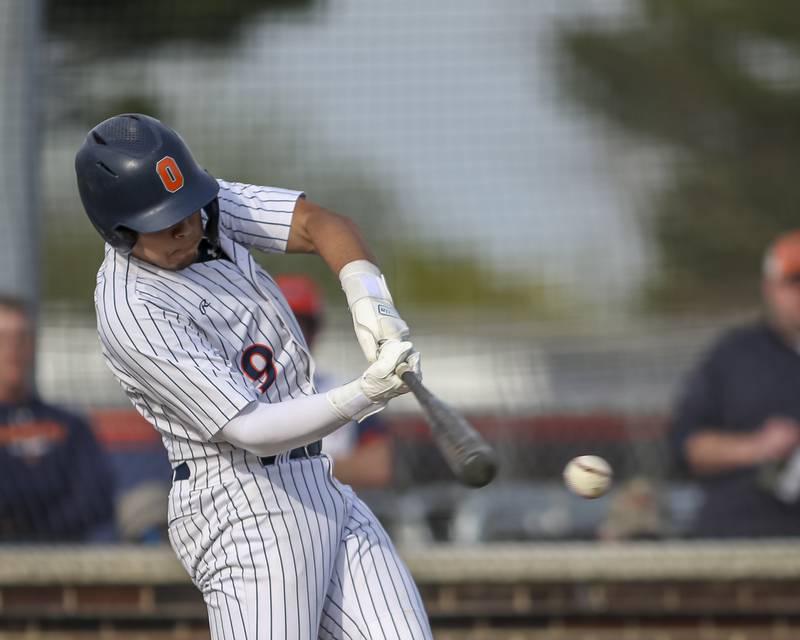 Oswego's Gabe Herrera (9) swings at a pitch during baseball game between Plainfield North at Oswego, Thursday, April 24, 2025 in Oswego.