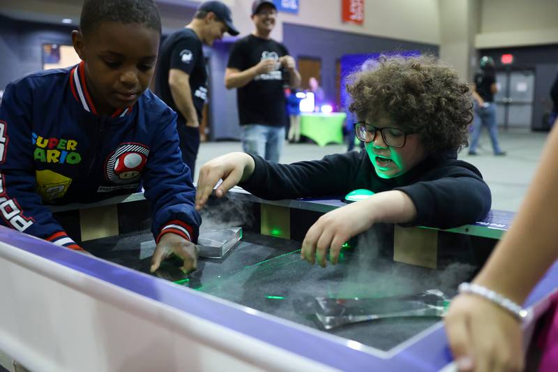 Kankakee students Malcolm Bulger, right, and Zion Pore experiment with laser refraction during the Impossible Science event at the Kankakee First Church of the Nazarene on May 5, 2026.