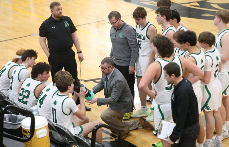 Seneca head boys basketball coach Nathaniel Meiss meets with his team during the Tri-County Conference Tournament on Tuesday, Jan. 27, 2026 at Putnam County High Schooo.