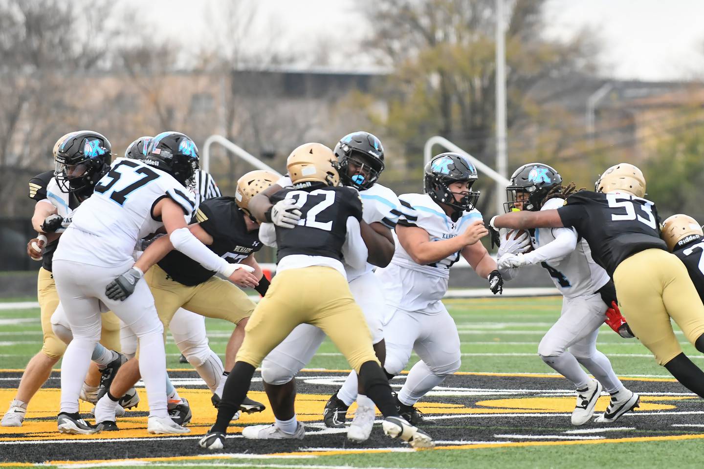 Kankakee's Dameir Green, center, makes a block during the Kays' 21-20 loss to Richards in the IHSA Class 6A Playoffs quarterfinal on Nov. 16, 2024.