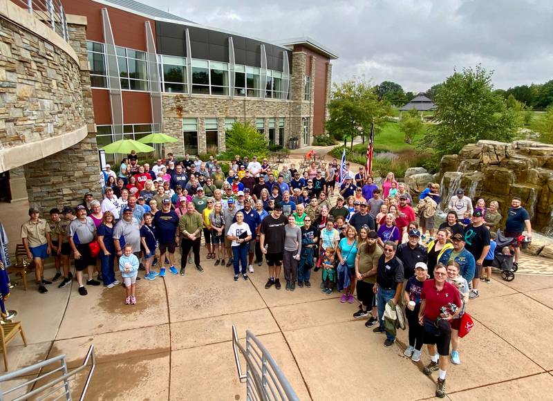 More than 130 participants pose for a group photo at the inaugural Be the One Walk, a 2.2-mile trek hosted by the Dekalb American Legion Post No. 66 and Legion Auxiliary to raise awareness about veteran suicide rates. The event was held at Northwestern Medicine Health and Wellness Center, 626 Bethany Road, DeKalb, on Sunday, Sept. 22, 2024.