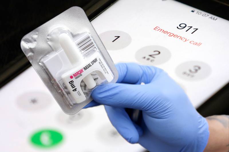 Live4Lali outreach coordinator Luis Aponte shows a Narcan nasal spray at their mobile unit on Wednesday, March 10, 2021 at A.J.M. Auto in McHenry.