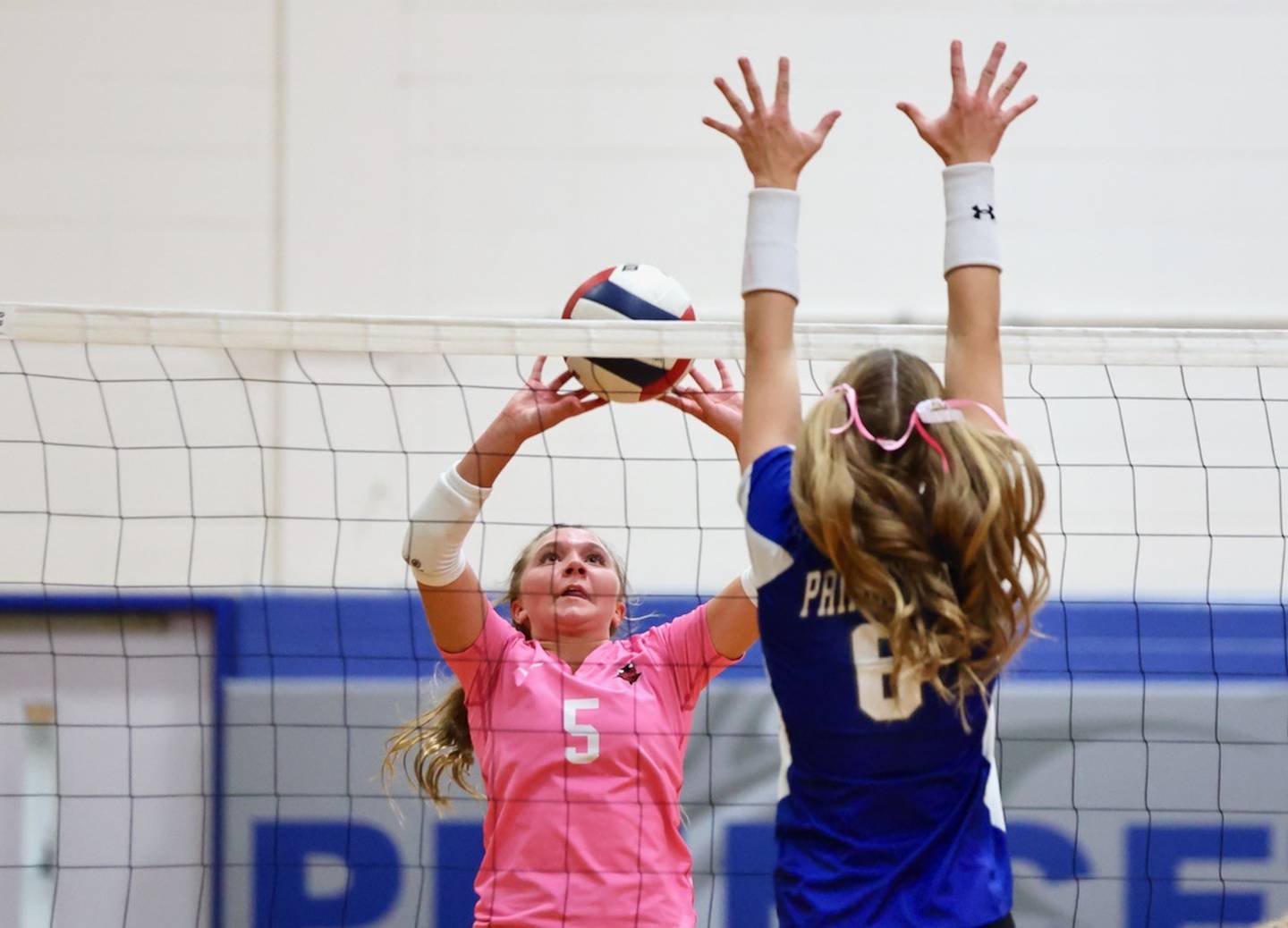 Hall's Charlie Pellegrini makes a play at the net against Princeton's Caroline Keutzer Thursday at Prouty Gym.