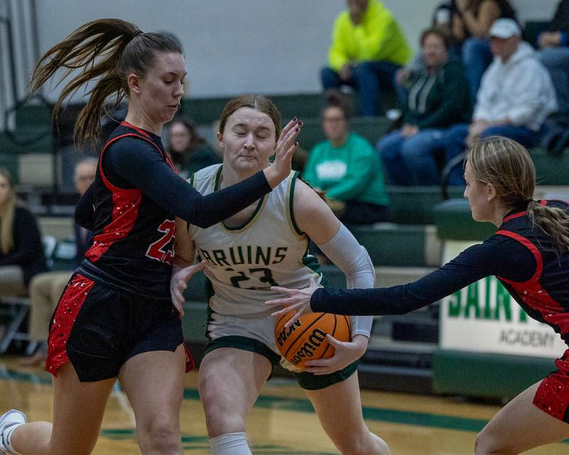 Lili McClain (23) of St. Bede drives ball down lane whilst getting bombarded by Orion's defense on Friday, December 26, 2025 at St. Bede High School in Peru.